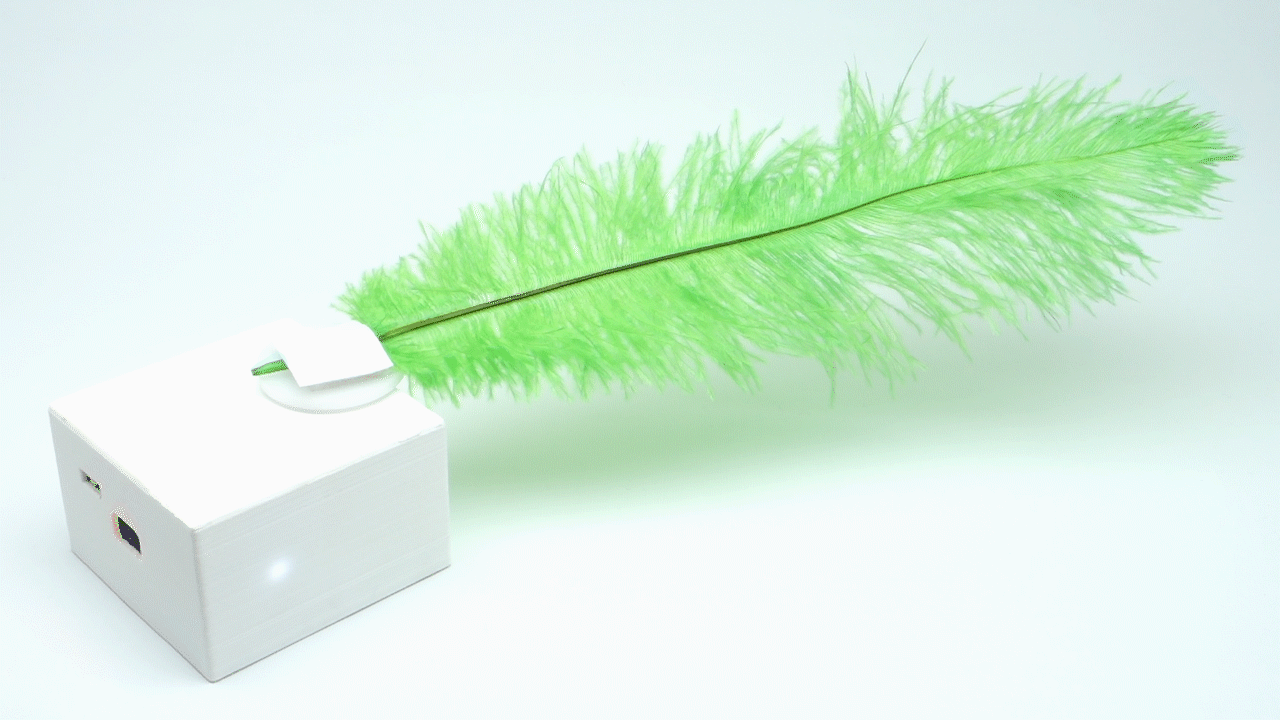 Animated image of a servo block wiggling a green feather.
